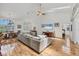 Bright and spacious living area with hardwood floors and a view of the dining area at 188 Grand Oak Cir, Venice, FL 34292