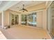 Covered patio with view of the pool and backyard at 188 Grand Oak Cir, Venice, FL 34292