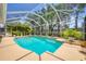 Inviting pool area with screened enclosure and lush landscaping at 188 Grand Oak Cir, Venice, FL 34292