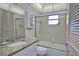 Well-lit bathroom features a shower-tub combination and a vanity with countertop at 200 The Esplanade N # C19, Venice, FL 34285