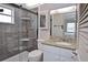 Elegant bathroom featuring a glass-enclosed shower and granite countertop vanity at 200 The Esplanade N # C19, Venice, FL 34285