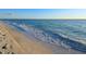 Beautiful beach with gentle waves lapping on the shore, creating a peaceful and inviting scene at 200 The Esplanade N # C19, Venice, FL 34285