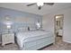 Tranquil bedroom with en-suite access, showcasing a blend of style and functionality at 200 The Esplanade N # C19, Venice, FL 34285