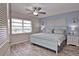 Spacious bedroom with a large window, stylish furnishings, and calming color palette at 200 The Esplanade N # C19, Venice, FL 34285