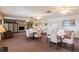 Spacious common room featuring tables, chairs, ceiling fans, and decorative accents at 200 The Esplanade N # C19, Venice, FL 34285
