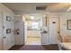 Charming white kitchen with modern appliances, tile floors, and plenty of cabinet space at 200 The Esplanade N # C19, Venice, FL 34285