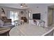 Open-concept living area with stylish furniture, blending comfort and design at 200 The Esplanade N # C19, Venice, FL 34285