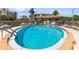 Sparkling pool surrounded by manicured landscaping and lounge chairs, perfect for sunny days at 200 The Esplanade N # C19, Venice, FL 34285