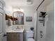 Cozy bathroom featuring a single vanity, framed mirror, and shower and bathtub combination at 2008 55Th E Ave, Bradenton, FL 34203