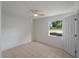Inviting bedroom with natural light highlighting the neutral walls and tile floors at 2008 55Th E Ave, Bradenton, FL 34203