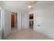 Bedroom showcasing tile floors, closet, and bathroom entrances at 2008 55Th E Ave, Bradenton, FL 34203