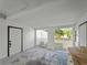Interior of carport with concrete flooring, side door, and view of the backyard at 2008 55Th E Ave, Bradenton, FL 34203