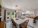 Dining area offering seamless access to the kitchen, backyard, and featuring stylish pendant lighting at 2008 55Th E Ave, Bradenton, FL 34203