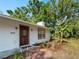 Charming single-story home featuring updated siding, dark trim windows, and a brick walkway at 2008 55Th E Ave, Bradenton, FL 34203