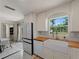 Bright kitchen featuring white cabinets, butcher block countertops, and modern appliances at 2008 55Th E Ave, Bradenton, FL 34203