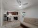 Open kitchen boasts stainless steel appliances, tile floors, and a portable island at 2008 55Th E Ave, Bradenton, FL 34203