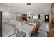Bright, open-concept living room featuring a kitchen, dining area, and cozy seating with lots of natural light at 2008 55Th E Ave, Bradenton, FL 34203