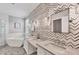 Modern bathroom features a soaking tub, double vanity, and stylish tile at 20235 Granlago Dr, Venice, FL 34293
