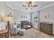 Charming Bedroom features a crib, glider, and dresser in soothing neutral tones, creating a serene environment at 20235 Granlago Dr, Venice, FL 34293