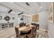 Formal dining room features an elegant chandelier and seating for six at 20235 Granlago Dr, Venice, FL 34293
