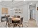 A dining room showcasing a round table with upholstered chairs and modern chandelier at 20235 Granlago Dr, Venice, FL 34293