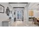Bright foyer showcasing tile flooring, stylish furnishings, and decorative accents at 20235 Granlago Dr, Venice, FL 34293