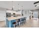 Bright kitchen with large island, stainless steel appliances, and ample cabinet space at 20235 Granlago Dr, Venice, FL 34293