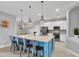 Spacious kitchen with stainless steel appliances, granite countertops, and breakfast bar at 20235 Granlago Dr, Venice, FL 34293