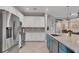 Beautiful kitchen with stainless appliances and a blue island at 20235 Granlago Dr, Venice, FL 34293