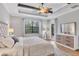 Light-filled main bedroom features wood flooring, an ensuite, and modern fixtures at 20235 Granlago Dr, Venice, FL 34293