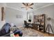 Well-appointed home office with blue couch, desk, and bookcase, perfect for remote work or study at 20235 Granlago Dr, Venice, FL 34293