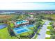 Aerial view of community amenities with pool and tennis and pickleball courts at 213 Malina Ct, Nokomis, FL 34275