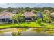 Aerial view of the house showcasing the tile roof and outdoor living space at 213 Malina Ct, Nokomis, FL 34275