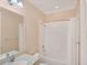 Well-lit bathroom with a shower-tub combo and a single sink vanity at 213 Malina Ct, Nokomis, FL 34275