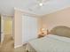Bedroom featuring a queen-sized bed, neutral walls, and closet at 213 Malina Ct, Nokomis, FL 34275