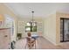 Bright breakfast nook with shuttered windows and views of water feature at 213 Malina Ct, Nokomis, FL 34275