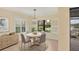 Cozy breakfast nook with ample natural light and scenic water view at 213 Malina Ct, Nokomis, FL 34275