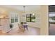 Bright breakfast nook with scenic views of the backyard water feature at 213 Malina Ct, Nokomis, FL 34275