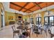 Clubhouse interior with stone fireplace, elegant lighting, and comfortable seating at 213 Malina Ct, Nokomis, FL 34275