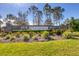 Stone community entrance sign and landscaping at Milano in Venice, Florida at 213 Malina Ct, Nokomis, FL 34275