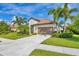 Attractive home showcasing a tile roof, well-kept lawn, and tasteful landscaping at 213 Malina Ct, Nokomis, FL 34275