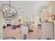 Open concept kitchen with stainless appliances and spacious island flows into the living room at 213 Malina Ct, Nokomis, FL 34275
