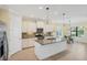 Bright kitchen with stainless steel appliances and an eat-in breakfast nook with a view at 213 Malina Ct, Nokomis, FL 34275