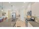 Bright kitchen with stainless steel appliances, spacious island, and tile backsplash at 213 Malina Ct, Nokomis, FL 34275