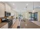 Well-equipped kitchen with stainless steel appliances and access to the outdoor patio at 213 Malina Ct, Nokomis, FL 34275