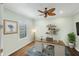 Bright office space with plantation shutters, ceiling fan, and work desk at 213 Malina Ct, Nokomis, FL 34275