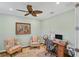 Bright office features cozy chairs, desk, and stylish decor at 213 Malina Ct, Nokomis, FL 34275