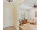 Bright home office with shuttered window, area rug, and adjacent to main entrance at 213 Malina Ct, Nokomis, FL 34275