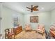 Home office with cozy chairs, area rug, and natural light at 213 Malina Ct, Nokomis, FL 34275