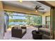 Inviting patio with cozy seating, a modern fire pit, and serene views of the lake, creating a perfect outdoor retreat at 213 Malina Ct, Nokomis, FL 34275